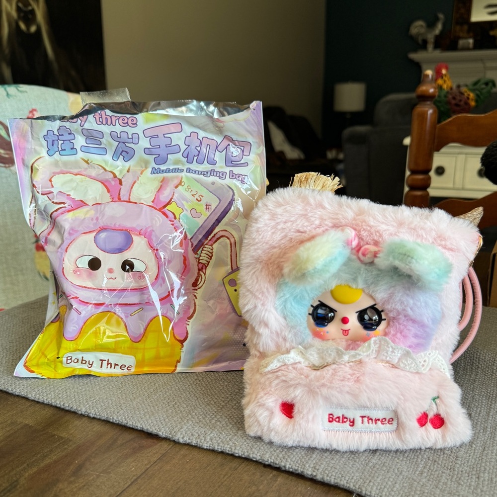SECRET Baby Three Mobile Hanging Bag, never used. Has special watery eyes!